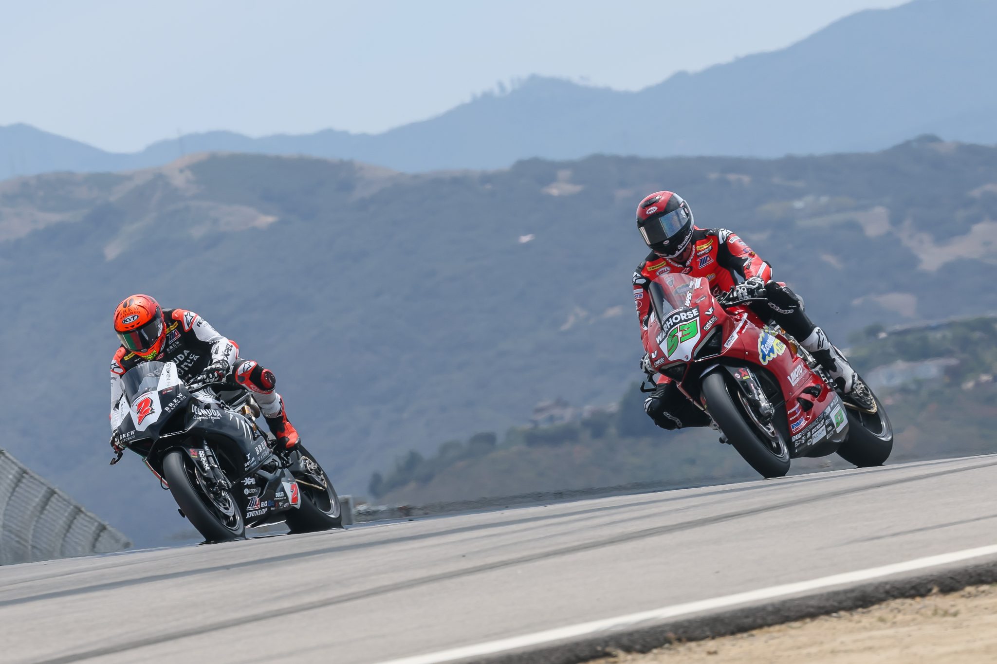 MotoAmerica King of the Baggers machines lined up in pit lane at Mid-Ohio Sports Car Course